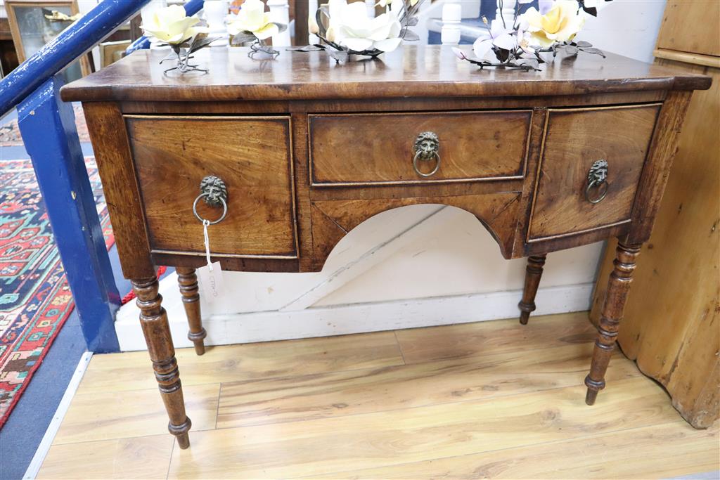 A small Regency mahogany bow front sideboard, width 107cm, depth 50cm, height 82cm